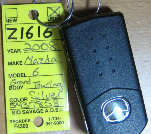 the tag of the car key which the dealer provided to me.gif